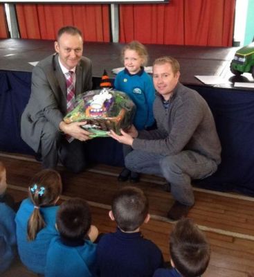 Mr Baldrick and Michael presenting Olivia in P2 with her PTA Hamper.